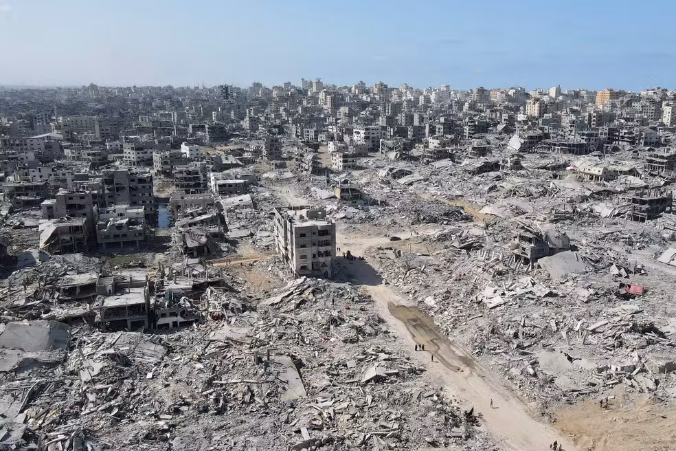 112661275-topshot-in-this-aerial-view-people-walk-amid-the-destruction-in-gaza-city-in-the-nor